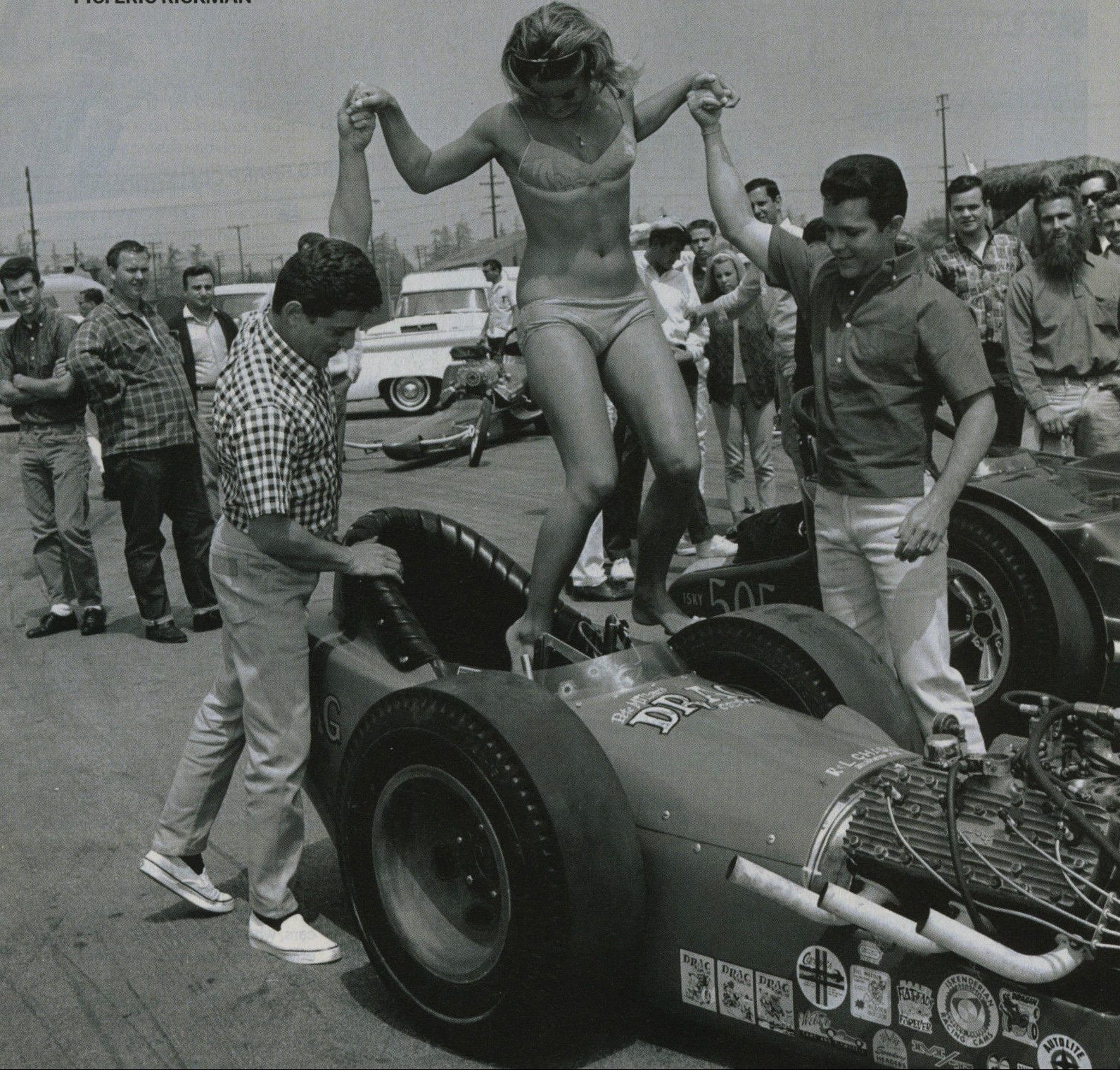 Frankie and John help Patti out of a Tommy Ivo drag-racer - 